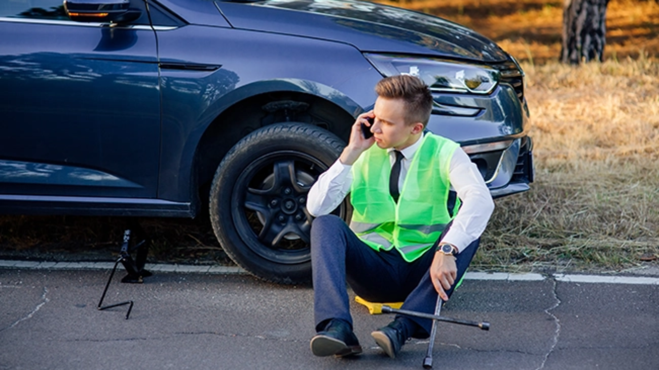 man-in-a-green-safety-vest-talking-on-cell-phone